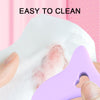Purple curved makeup guide being wiped with a white cloth