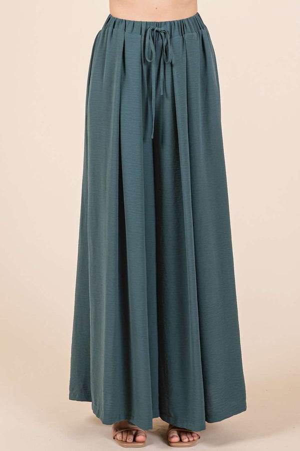 Mittoshop hunter green pleated wide leg pants, front view showing drawstring waist