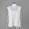 White polka-dot blouse on a clear mannequin, front