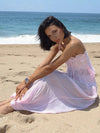 Pink crop top and gathered-ankle pants, seated view