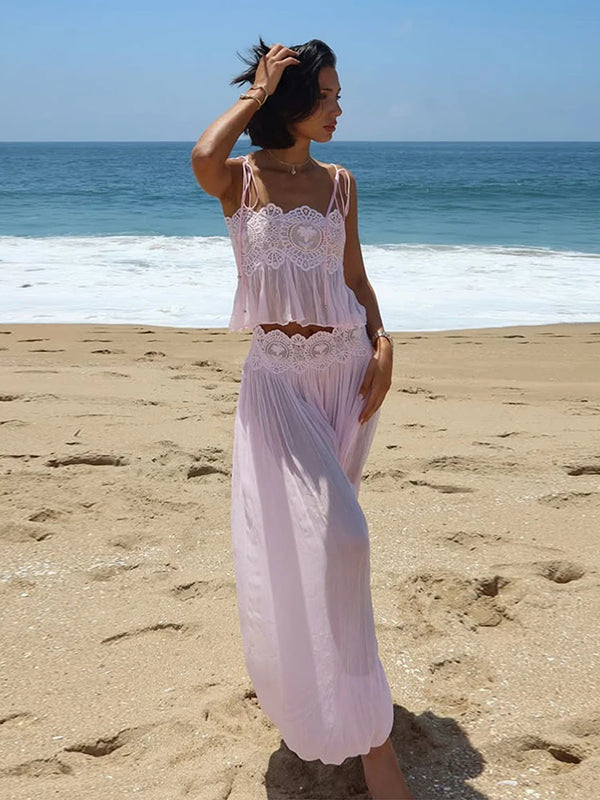 Pink two-piece lace-trim outfit at the beach