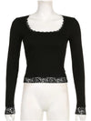 Black lace-trim top displayed on a mannequin