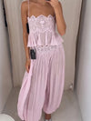 Pink lace-trim crop top and pleated pants