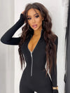 Black jumpsuit showing front zipper and stand collar