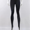 Black high-waisted stirrup leggings shown from the front on a mannequin
