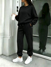 Side view of the black matching sweatshirt and joggers