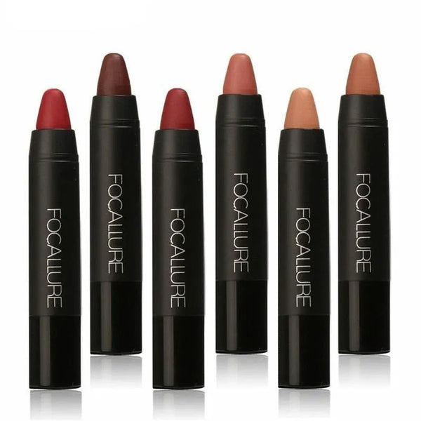 Five uncapped lip crayons in red, brown and nude tones