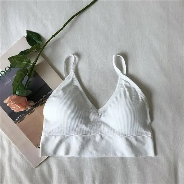White ribbed V-neck bralette arranged in a flat lay