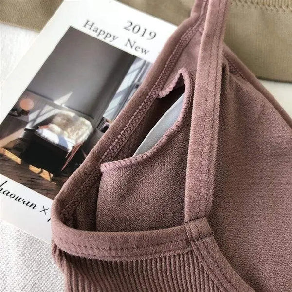 Close-up of mauve ribbed bralette fabric and narrow shoulder strap