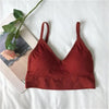 Rust red ribbed V-neck bralette arranged in a flat lay