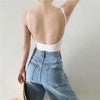 White ribbed bralette worn with blue jeans, back view