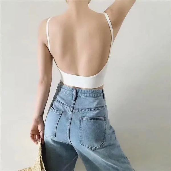 White ribbed bralette worn with blue jeans, back view