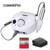 White electric nail drill with handpiece, foot pedal, and six drill bits