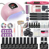 Nail art kit with a pink dome lamp, pink nail drill, gel bottles, files, and accessories