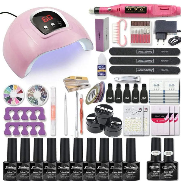 Nail art kit with a pink dome lamp, pink nail drill, gel bottles, files, and accessories