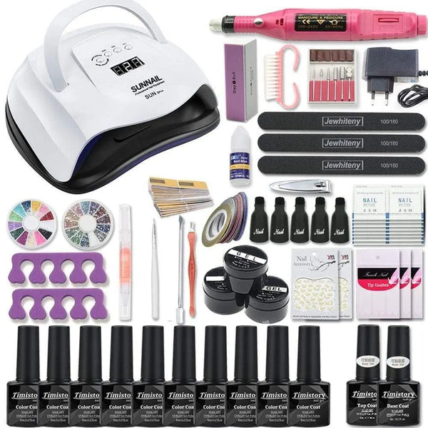 Nail art kit with a black-trim white lamp, pink nail drill, gel bottles, and accessories