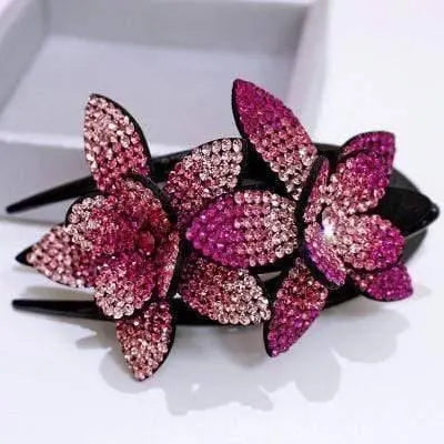 Pink and magenta rhinestone flower cluster on a black hair claw