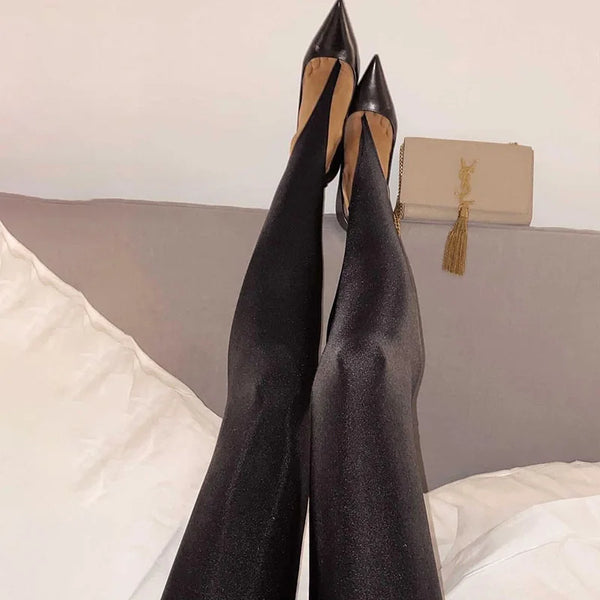Black stirrup leggings and pointed heels shown from above