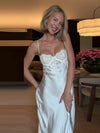 White lace-bodice slip dress with a flowing skirt