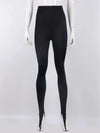 Full front view of black stirrup leggings on a white mannequin