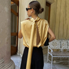 Champagne blouse showing open back and long neck ties