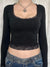 Black square-neck top with lace trim