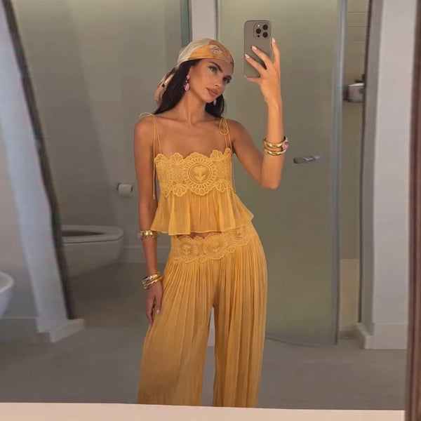 Yellow lace-trim crop top and pleated pants