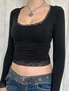Black long-sleeve lace-trim top, front view